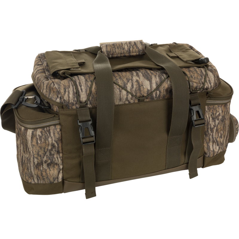 Extra Large Blind Bag with camouflage pattern, straps, and 20 organizational pockets for quick gear access. Waterproof and durable construction with adjustable shoulder strap. Ideal for hunting and outdoor activities.