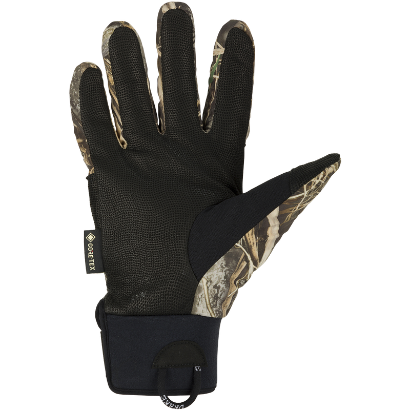MST Refuge HS GORE-TEX Gloves: A black glove with a camouflage pattern, designed for in-between seasons. Waterproof and breathable for effective field use.