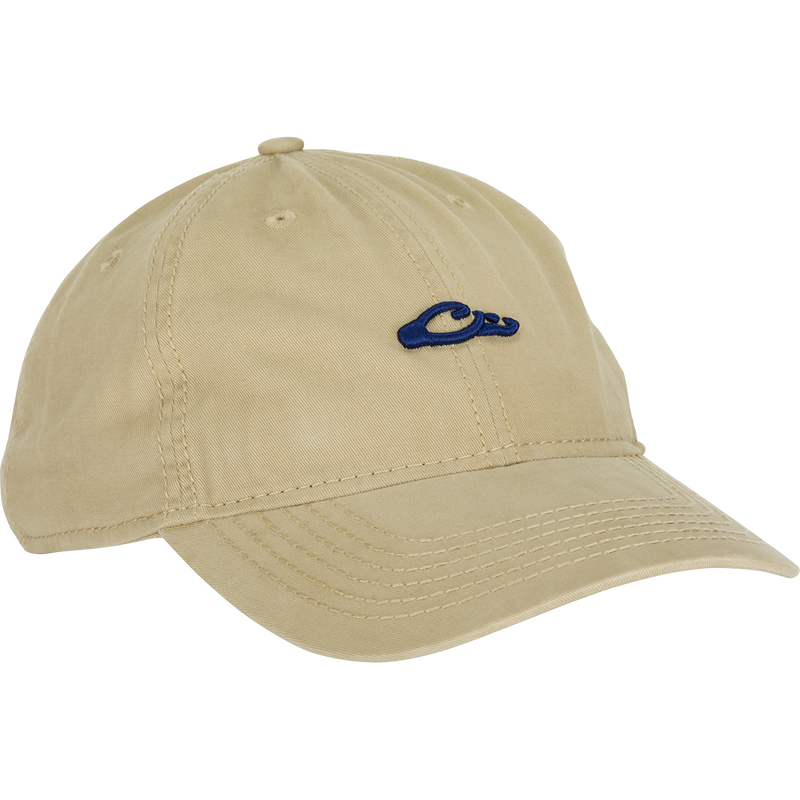 Cotton Twill Logo Cap - A low-profile tan baseball cap with a blue logo. Crafted with 100% cotton twill, leather strap back with brass buckle, and contoured bill. Perfect for pushing yourself to the limit in style.