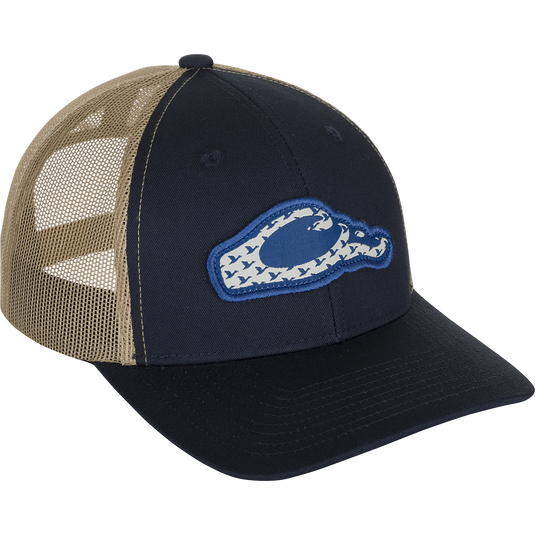 Drake 6 Panel Migrator Cap: A stylish trucker cap with a raised Drake head logo featuring migrating ducks. Breathable and comfortable for everyday wear.
