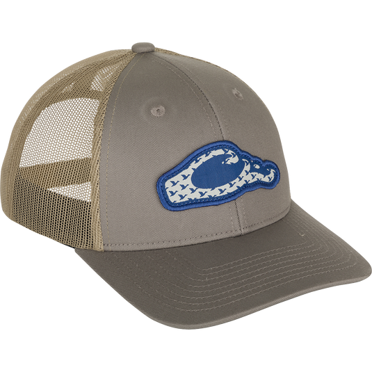 Drake 6 Panel Migrator Cap - A stylish trucker cap with a blue and white patch featuring migrating ducks flying through the logo. Breathable and comfortable, perfect for everyday wear.