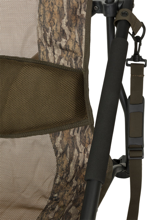 XL Low Profile Hunting Chair: Close-up of seat, strap, chair, net, camouflage fabric, metal ring, bag, basket, and mesh pocket. Rugged, comfortable, foldable design with webbing shoulder strap. Perfect for hunting from under a tree or in blinds.