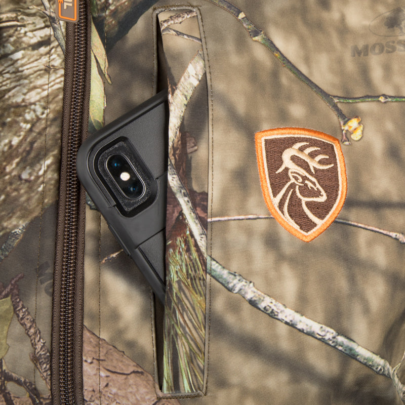 Camo Tech Vest with Agion Active XL® - A versatile garment for bow hunters, featuring complete arm movement, windproof lining, and multiple pockets for quick access. Perfect for all-season protection.