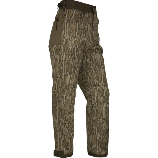 A pair of Standstill Windproof Pants with Agion Active XL®, perfect for late-season hunts. Made of durable polyester fabric with scent control technology. Features front slash pockets, cargo pockets, rear pockets, adjustable waist, and cuffs. Ideal for harsh cold and winds.