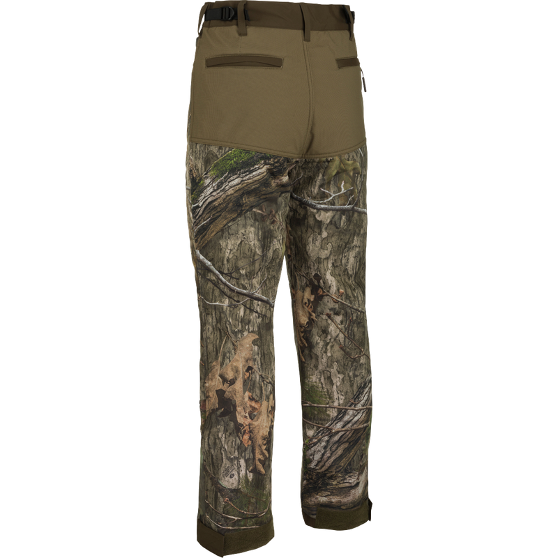 A pair of Standstill Windproof Pants with Agion Active XL®, perfect for late-season hunts. Soft, quiet, and durable, these pants protect against harsh cold and winds. Features include 2 front slash pockets, 2 large cargo pockets, 2 rear pockets, adjustable waist, and adjustable Velcro cuffs.