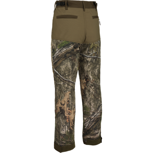 A pair of Standstill Windproof Pants with Agion Active XL®, perfect for late-season hunts. Soft, quiet, and durable, these pants protect against harsh cold and winds. Features include 2 front slash pockets, 2 large cargo pockets, 2 rear pockets, adjustable waist, and adjustable Velcro cuffs.