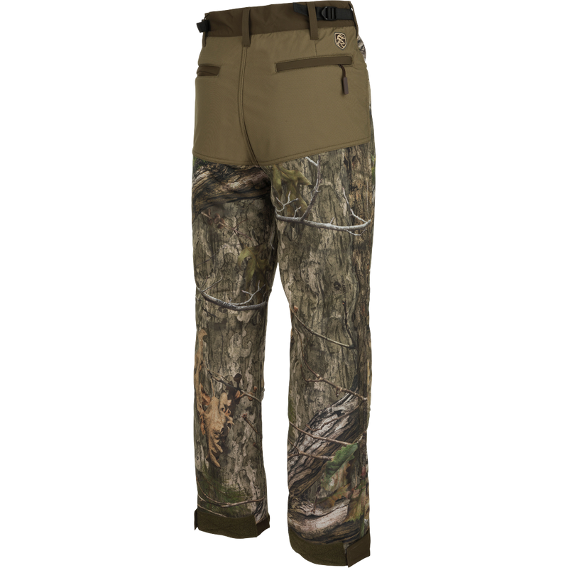 A pair of Standstill Windproof Pants with Agion Active XL®, perfect for late-season hunts. Soft, quiet, and durable fabric protects against harsh cold and winds. Features adjustable waist and cuffs, multiple pockets.