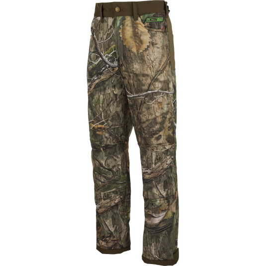 Standstill Windproof Pants with Agion Active XL®, a pair of camouflage cargo pants perfect for late-season hunts. Made with durable polyester fabric and fleece backing, these pants provide warmth and protection against the cold and wind. Features adjustable waist and cuffs, front slash pockets, large cargo pockets, and rear pockets. Ideal for big game hunting, waterfowl hunting, turkey hunting, and fishing.