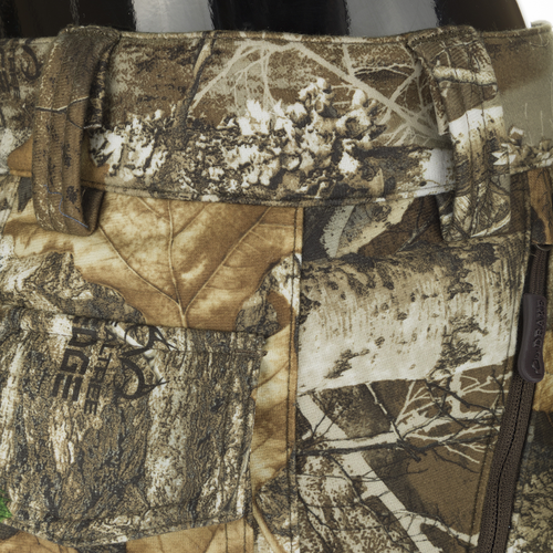 MST Microfleece Softshell Pant: Close-up of camouflage fabric with side zips and zippered pockets for easy movement and storage.