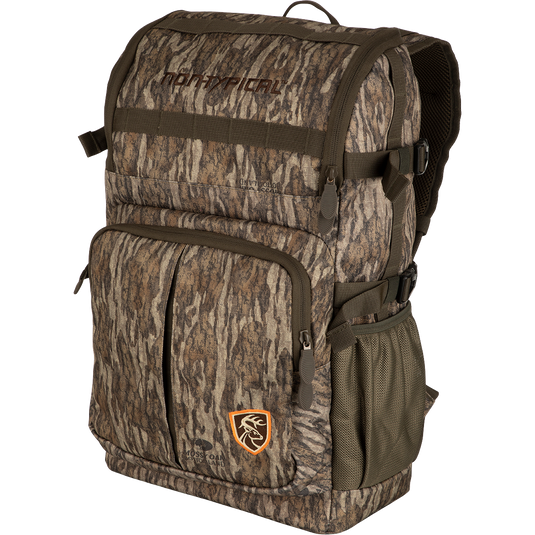A Non-Typical Rucksack, featuring a camouflage backpack with a logo of a deer. Versatile pockets, MOLLE loops, and adjustable straps for hunting necessities.