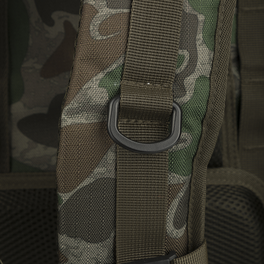Non-Typical Rucksack: A versatile backpack with webbing, patterned fabric, and multiple pockets for hunting necessities. Adjustable straps and MOLLE loops for customization.