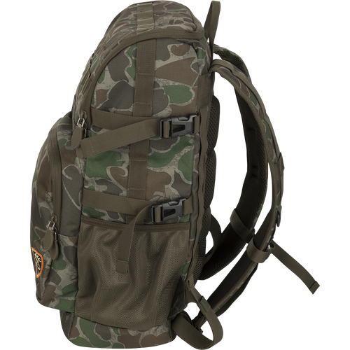 A Non-Typical Rucksack, featuring a camouflage pattern backpack with adjustable shoulder straps, multiple pockets, and MOLLE loops for customizable functionality. Perfect for storing hunting necessities.