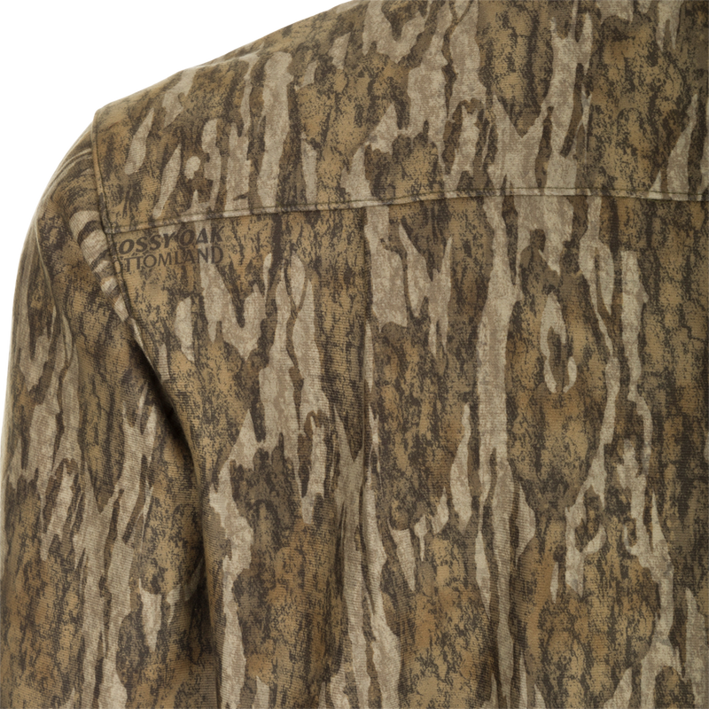 MST Microfleece Softshell Shirt: A close-up of a camouflage shirt with wind-resistant fabric, microfleece lining, and scent control technology.