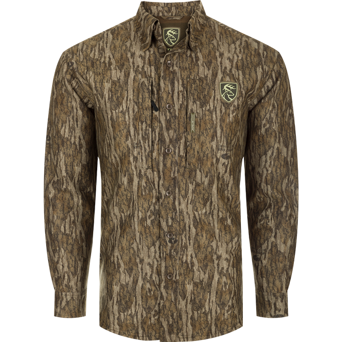MST Microfleece Softshell Shirt: A long-sleeved shirt with a tree pattern and logo. Made of wind-resistant fabric with a microfleece lining. Features scent control technology, 7-button placket, gusseted underarm, 4-way stretch, and convenient pockets. Ideal for hunting and outdoor activities.