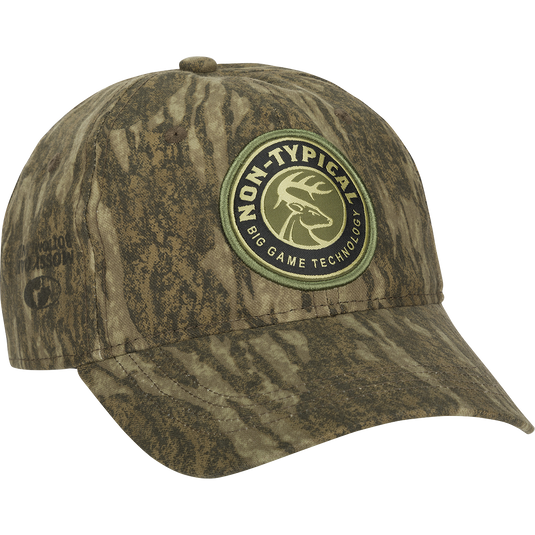 A Big Game Technology Patch Camo Twill Cap with a logo on it, offering full camo concealment and a comfortable 60% cotton/40% polyester construction. Features a six-panel design and adjustable snap closure.
