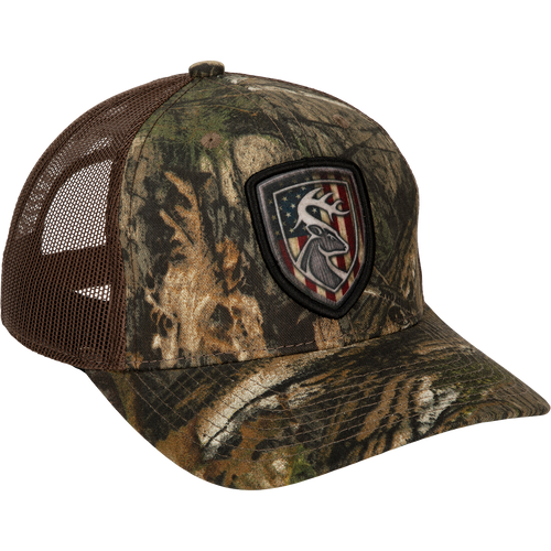 Americana Shield Patch Mesh-Back Cap with deer head and flag patch on cotton twill front panels and breathable mesh back. Adjustable snap closure.