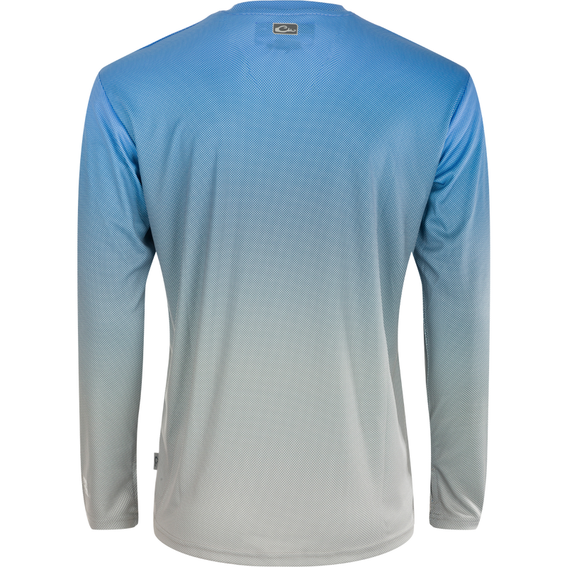Performance Ombre Dot Long Sleeve Crew: A highly functional, lightweight shirt with cooling technology, UPF 50, moisture-wicking, and quick-drying properties. Features a unique Ombre pattern with a digitally printed Micro Dot for an illusion of movement. Perfect for water activities, beach outings, and performance needs.