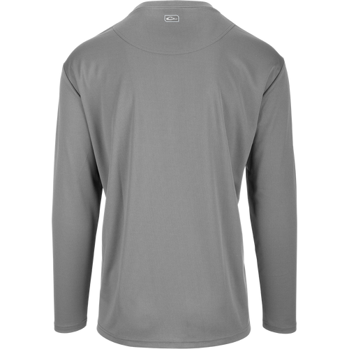 A versatile Performance Mesh Crew shirt with built-in stretch, UPF 50 sun protection, and moisture-wicking fabric. Features thumbholes for added sleeve protection and a square hem for tucking or untucking. Perfect for outdoor enthusiasts.