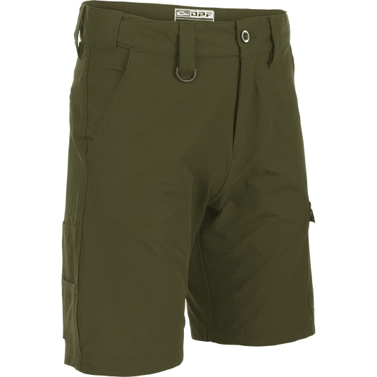 A close-up of the Performance Hybrid Fishing Short 9". Green shorts with multiple pockets, D ring, and adjustable waistband for a better fit. Made of 97% Nylon Taslon and 3% Spandex for comfort and durability. Ideal for fishing and outdoor activities.