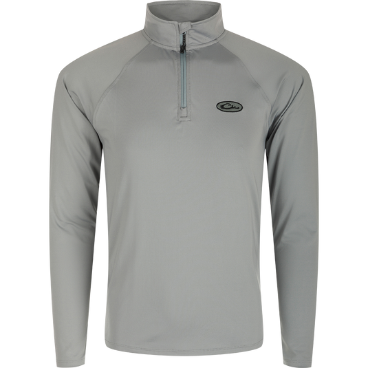 A grey long sleeved shirt with a zipper, part of the Microlite Performance 1/4 Zip Solid collection. Moisture-wicking, quick-drying, and odor-resistant, this lightweight shirt offers UPF sun protection and 4-way stretch. Perfect for outdoor activities.