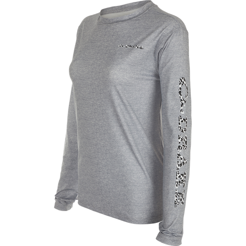 Women's Performance Crew Heather Shirt, a lightweight grey long sleeved top with black and white animal print on sleeve. Built-In Cooling, UPF 50, Moisture Wicking, Breathable Stretch, and Quick Drying.
