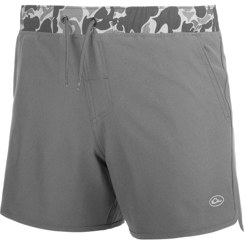 A youth commando lined volley short with a camo print, quick-drying fabric, and adjustable drawstring waist.