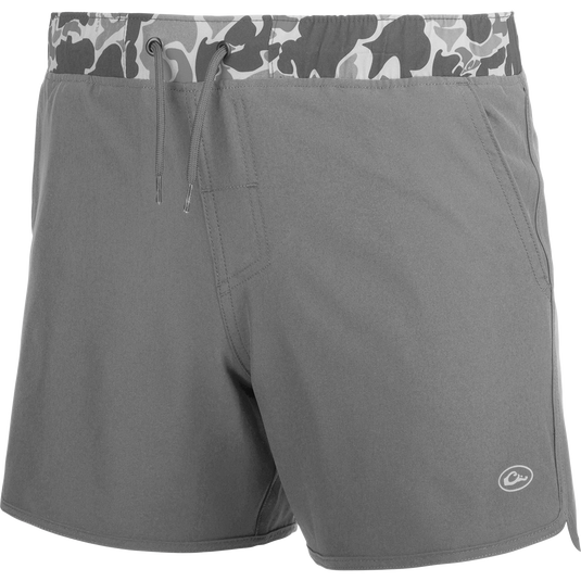 A youth commando lined volley short with a camo print, quick-drying fabric, and adjustable drawstring waist.