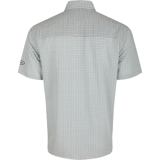 A back view of the Traveler's Minigrid Short Sleeve Shirt, a lightweight and breathable shirt with four-way stretch for freedom of movement. Ideal for the man on the go, whether on vacation or running errands. Split tail hem allows for tucked or untucked wear.