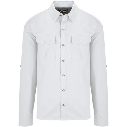 Traveler's Solid Dobby Shirt L/S: A white shirt with long sleeves, hidden button-down collar, and two chest pockets with button-through flaps. Classic fit, versatile for any season.