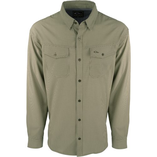 A lightweight, wrinkle-resistant Traveler's Check Shirt L/S with moisture-wicking fabric and two chest pockets with button flaps. Ideal for the man on the go, offering freedom of movement and ultimate comfort.