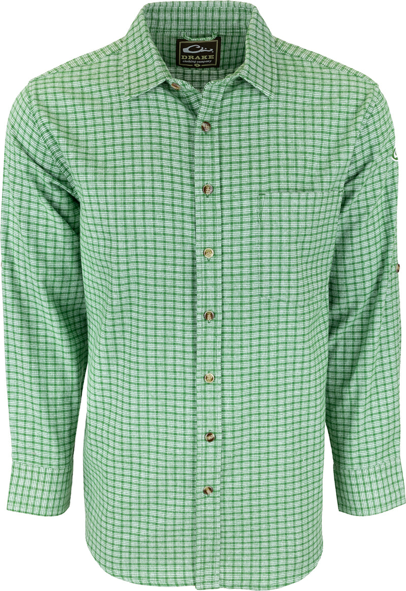 A green and white checkered shirt with an open collar and left chest pocket. Made of soft-washed 100% cotton for comfort. Perfect for a casual and stylish look. From Drake Waterfowl, known for high-quality hunting gear and clothing.
