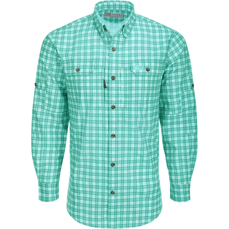Hunter Creek Check Plaid Shirt L/S: A lightweight, moisture-wicking shirt with micro-mesh for natural cooling. Features include UPF 30 sun protection, hidden button-down collar, and vented back cape. Two chest pockets with Magnattach and zipper closures. Sculpted hem with built-in sunglass wipe. Adjustable roll-up sleeves. High performance and functional for hunting and outdoor activities.