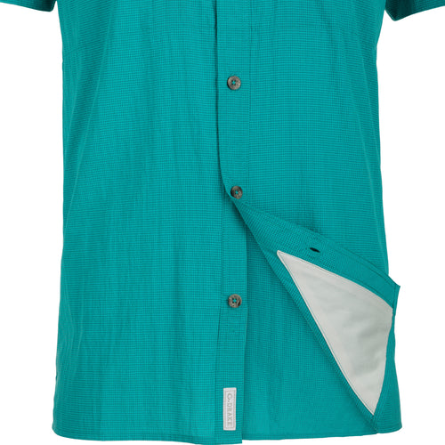 Classic Seersucker Minicheck Shirt with hidden zippered chest pocket and Magnattach™ closure. Moisture-wicking, quick-drying fabric with UPF30 sun protection. Vented cape back for added ventilation. Split tail hem for versatile wear.