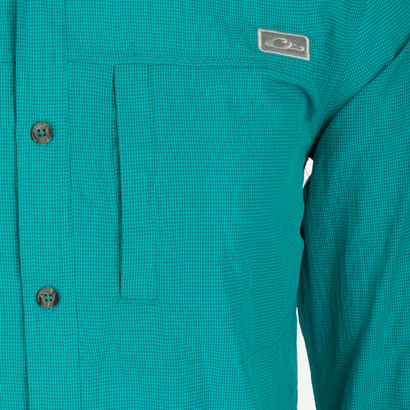Classic Seersucker Minicheck Shirt: Close-up of a soft, featherweight shirt with hidden button-down collar, zippered chest pocket, and split tail hem.