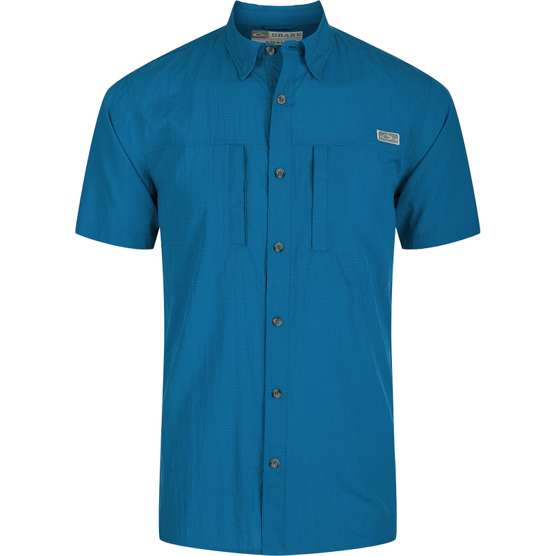 Classic Seersucker Minicheck Shirt: A button-down collar shirt with hidden zippered chest pocket and Magnattach closure. Vented cape back and split tail hem for added ventilation and versatile styling. Moisture-wicking, quick-drying fabric with UPF 30 sun protection.