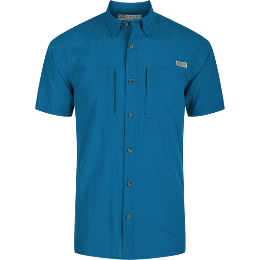 Classic Seersucker Minicheck Shirt: A button-down collar shirt with hidden zippered chest pocket and Magnattach closure. Vented cape back and split tail hem for added ventilation and versatile styling. Moisture-wicking, quick-drying fabric with UPF 30 sun protection.