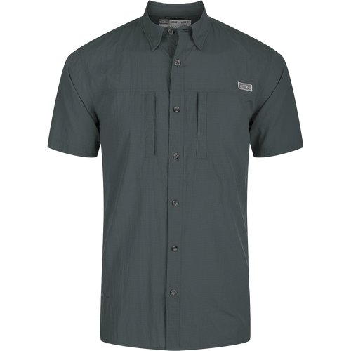 Classic Seersucker Minicheck Shirt: Close-up of a black shirt with a patch, button detail, and hidden zippered chest pocket.