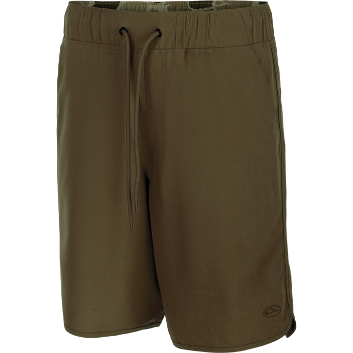 A pair of Commando Lined Volley Shorts with drawstring, scalloped hem, and hidden zipper pockets. Versatile and quick-drying, perfect for beach to bar.