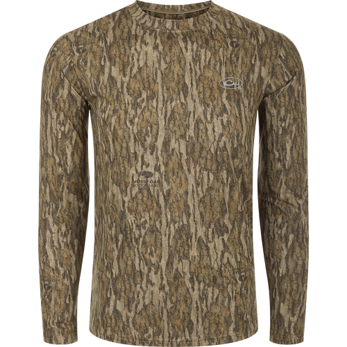 A long sleeved shirt with a tree pattern, designed for optimum comfort and durability. Made of 92% Polyester/8% Spandex with 4-Way Stretch for flexibility. Features Shield 4 Sun™ UPF 50+, Shield 4 Coolant™, Shield 4 Odor™, and Shield 4 Stains™ treatments for sun protection, heat resistance, odor control, and stain resistance. From Drake Waterfowl, a store specializing in high-quality hunting gear and clothing.