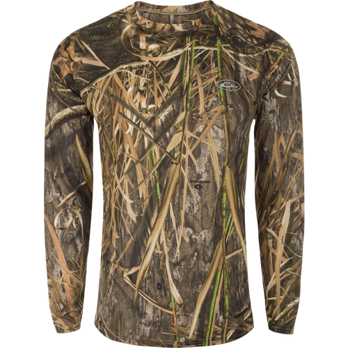 A long sleeved shirt with a camouflage pattern, designed for optimum comfort and durability. Made of 92% Polyester/8% Spandex with 4-Way Stretch for flexibility and protection. Features Shield 4 Sun™ UPF 50+, Shield 4 Coolant™, Shield 4 Odor™, and Shield 4 Stains™ treatments for effective sun, heat, odor, and stain protection. EST Camo Performance Crew L/S from Drake Waterfowl.