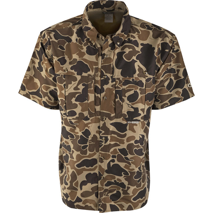 EST Camo Wingshooter's Shirt S/S: Lightweight, breathable shirt for dove hunts, teal and goose hunts, or the shooting range. Vented areas, mesh back, and heat vents provide comfort and air circulation. Magnattach pocket, sun blocker collar, and large chest pockets for convenience.