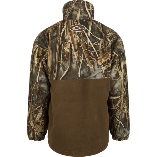 MST Youth Eqwader Full Zip Jacket: A camouflage-patterned jacket with waterproof sleeves and upper body, and breathable fleece on the lower body. Features include Magnattach pocket, zippered chest pocket, and kangaroo pouch. Ideal for waterfowl hunting and outdoor activities.