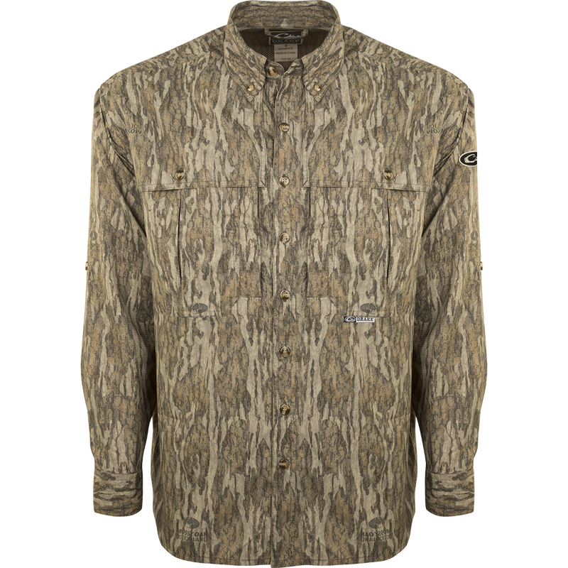 A lightweight, breathable EST Camo Flyweight Wingshooter's Shirt with a camouflage pattern. Made of 100% polyester for quick drying and moisture-wicking. Features include UPF 50+ sun protection, vented mesh back, and multiple chest pockets. Perfect for early season hunting.