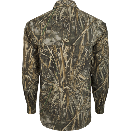 A close-up of the EST Camo Flyweight Wingshooter's Shirt, a lightweight and breathable hunting shirt made of 100% polyester. Features include UPF 50+ sun protection, vented mesh back, and multiple chest pockets. Perfect for early season hunting.