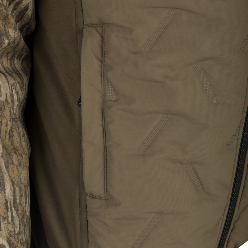 A close-up of the Youth LST Guardian Flex Double Down Eqwader 1/4 Zip Jacket, featuring a khaki military uniform fabric with a zipper and multiple chest pockets. Superior protection from the elements with waterproof/windproof upper body, double down insulation, and elbow/forearm protection. Ideal for outdoor pursuits.
