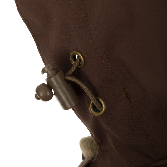 A close-up of the McAlister G3 Flex 3-in-1 Waterfowler's Jacket, featuring a brown fabric with a rope detail.