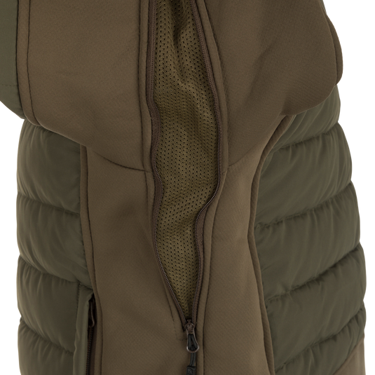 McAlister G3 Flex 3-in-1 Waterfowler's Jacket - A versatile jacket for hunting in various weather conditions, featuring a close-up of a khaki jacket with a zipper and durable fabric.