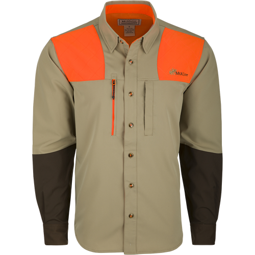 McAlister MST Upland Tech Shirt: A long-sleeved shirt with orange and black stripes, featuring a collar, button, and abrasion-resistant forearm. Includes chest pockets and an integrated lens cloth. Made of nylon, Spandex, and polyester. Ideal for hunting and outdoor activities.