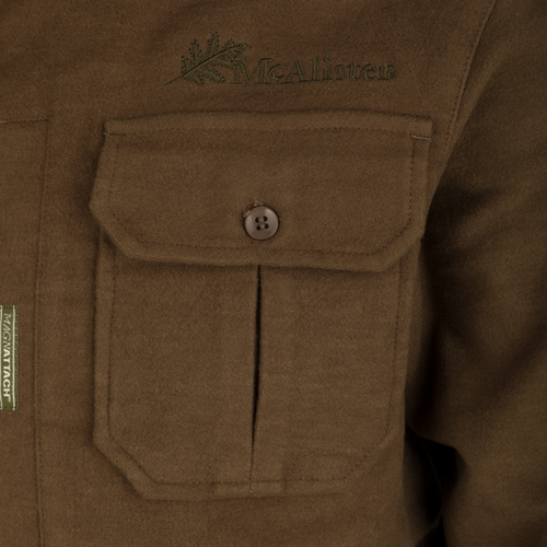 A close-up of the McAlister Windproof Moleskin Jac-Shirt's pocket and button, showcasing its durable design and functionality.