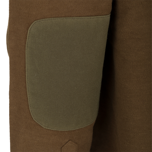 A close-up of the McAlister Windproof Moleskin Jac-Shirt, showcasing its brown fabric and Dry Waxed 100% Canvas Elbow Patches.